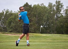 Man swinging golf club